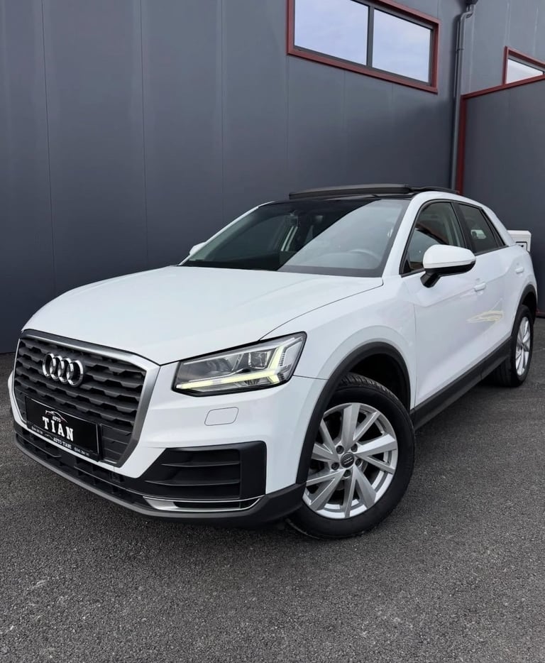 White Audi Q2 SUV parked indoors