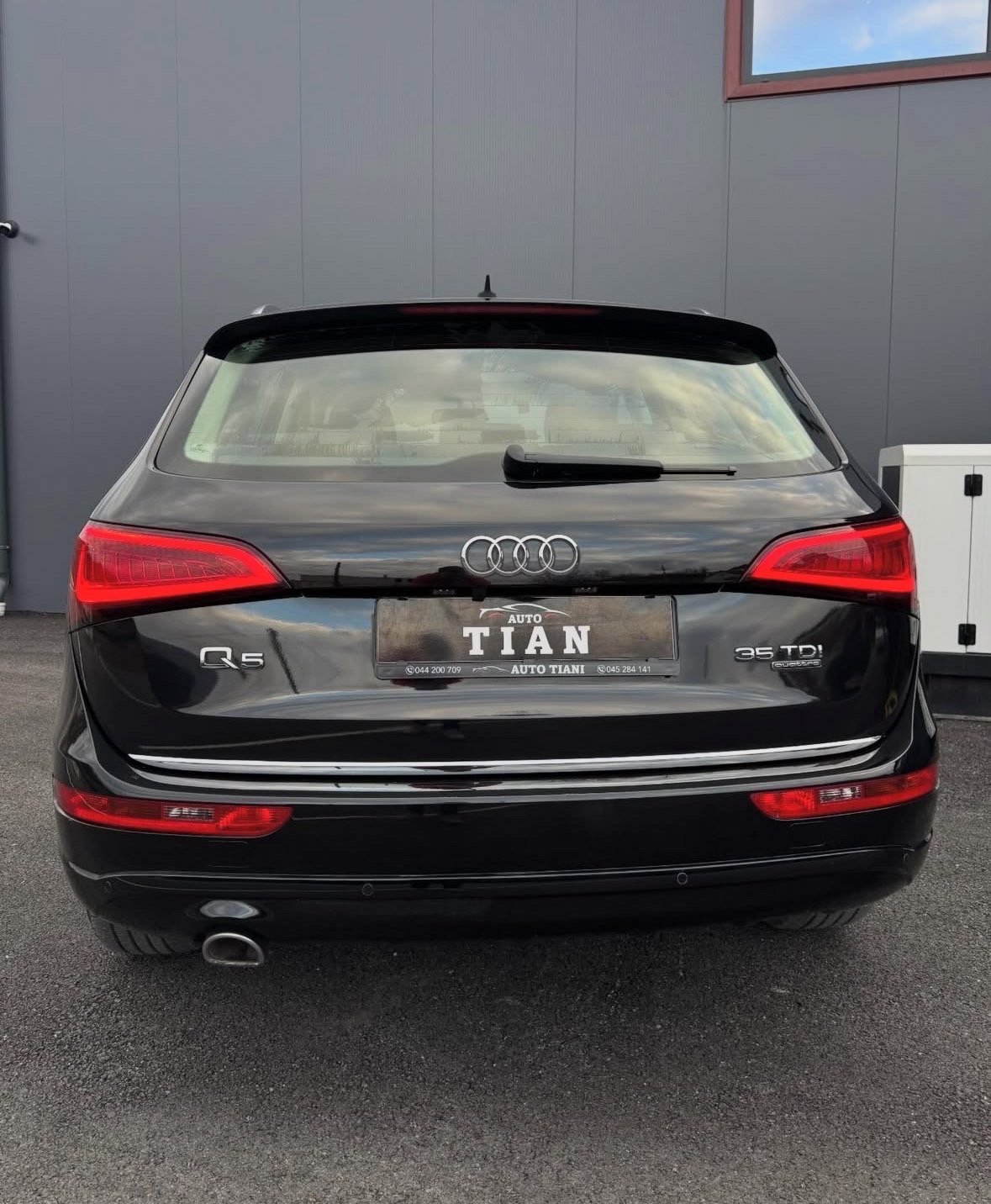 Black Audi Q5 SUV rear view with red taillights