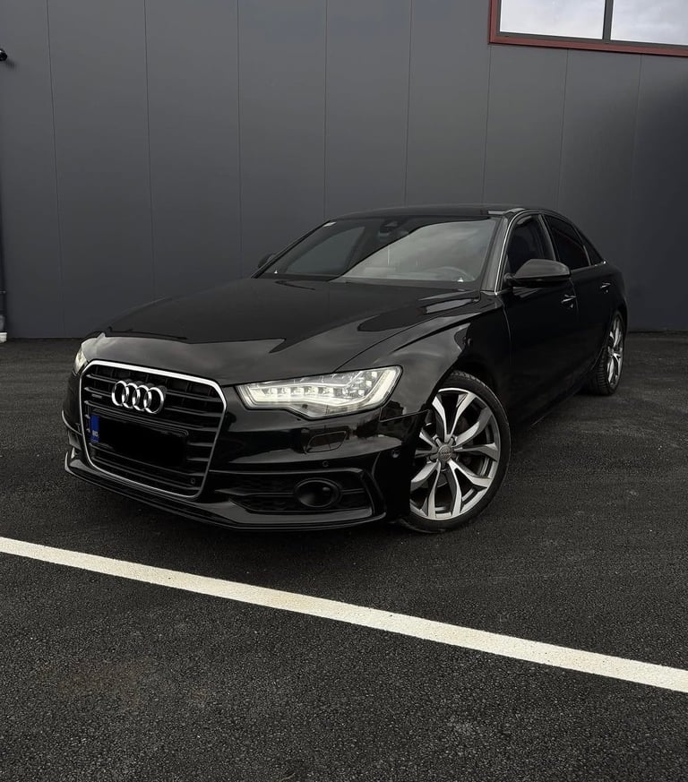 Black Audi A6 sedan parked in lot