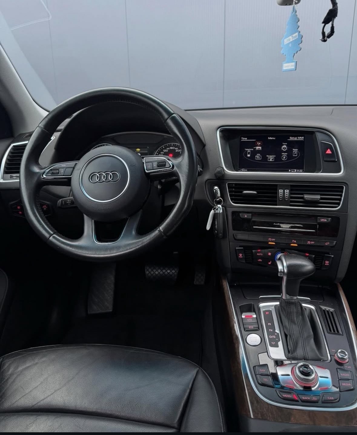 Audi car interior with black steering wheel